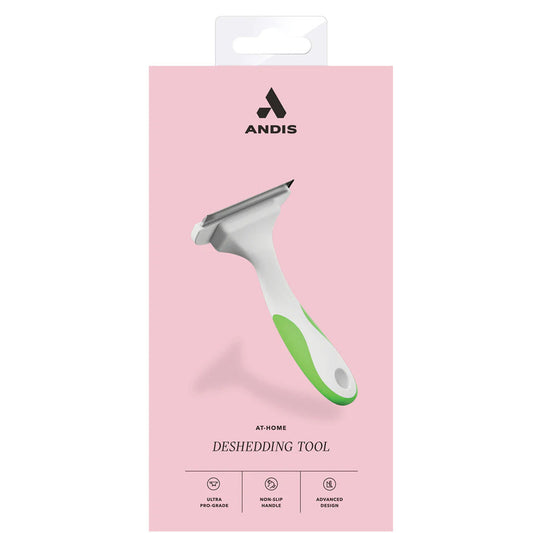 Andis at-home deshedding tool packaging on a pink background