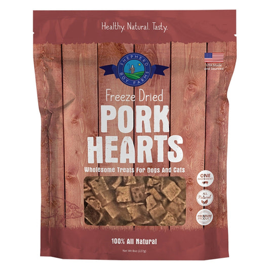 Package of freeze-dried pork hearts for pets on a wooden background