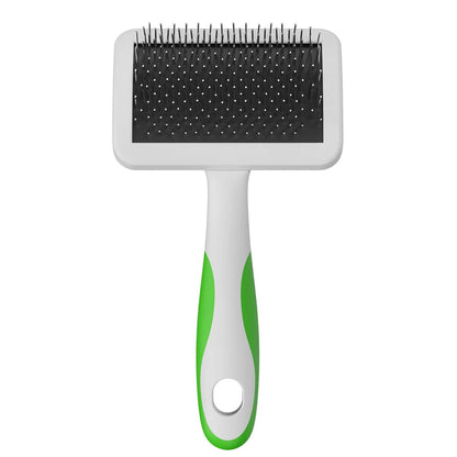 Pet grooming brush with black bristle side and green handle on a white background