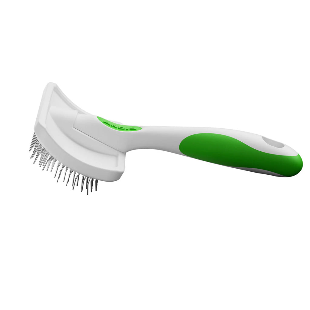 Pet grooming brush with green handle on a white background