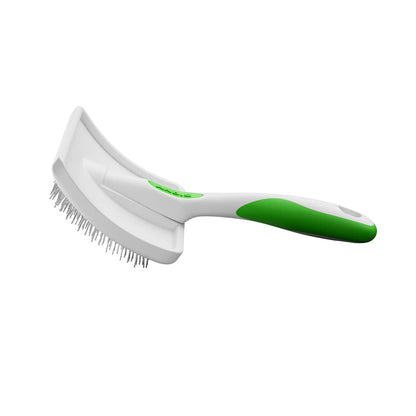 White and green pet grooming brush on a white background