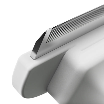 Close-up of a metallic object with a textured surface on a white background