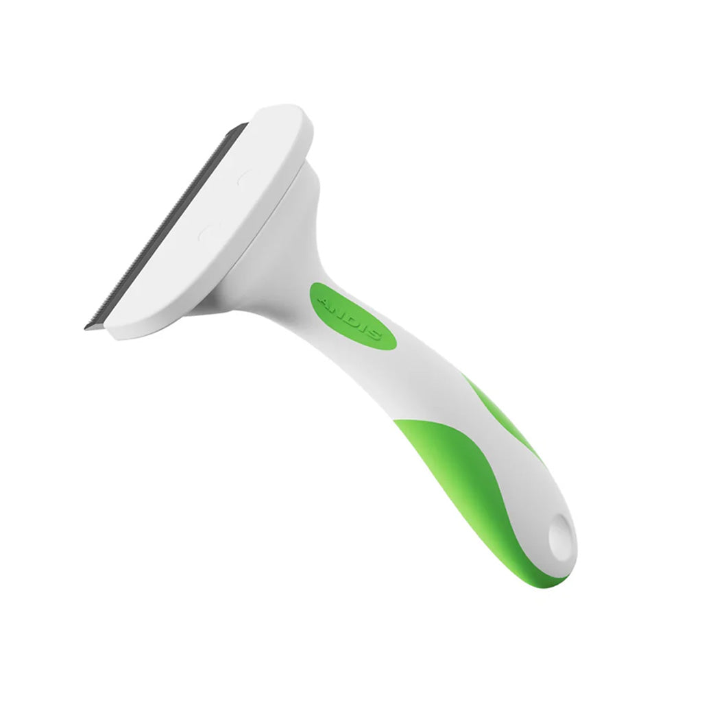 White and green pet grooming brush on a white background