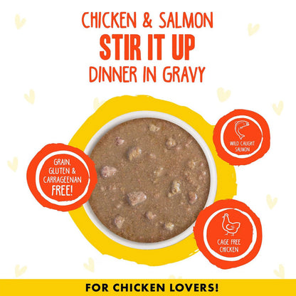 Dog food package with chicken and salmon text, featuring a bowl of dog food on a white background.