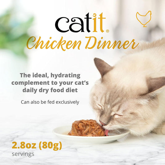 Catit Chicken Dinner packaging with a cat eating from a plate on a marble surface.