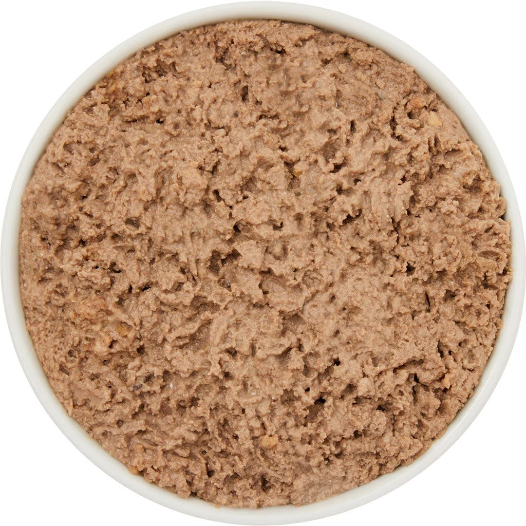 Close-up of a bowl filled with brown food on a white background