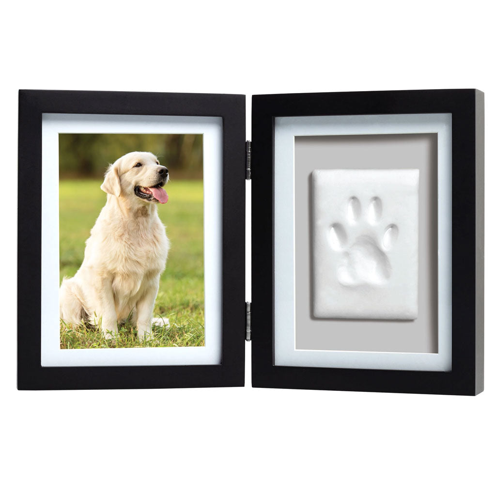 Black double frame with a photo of a dog on one side and a paw print on the other, on a white background.