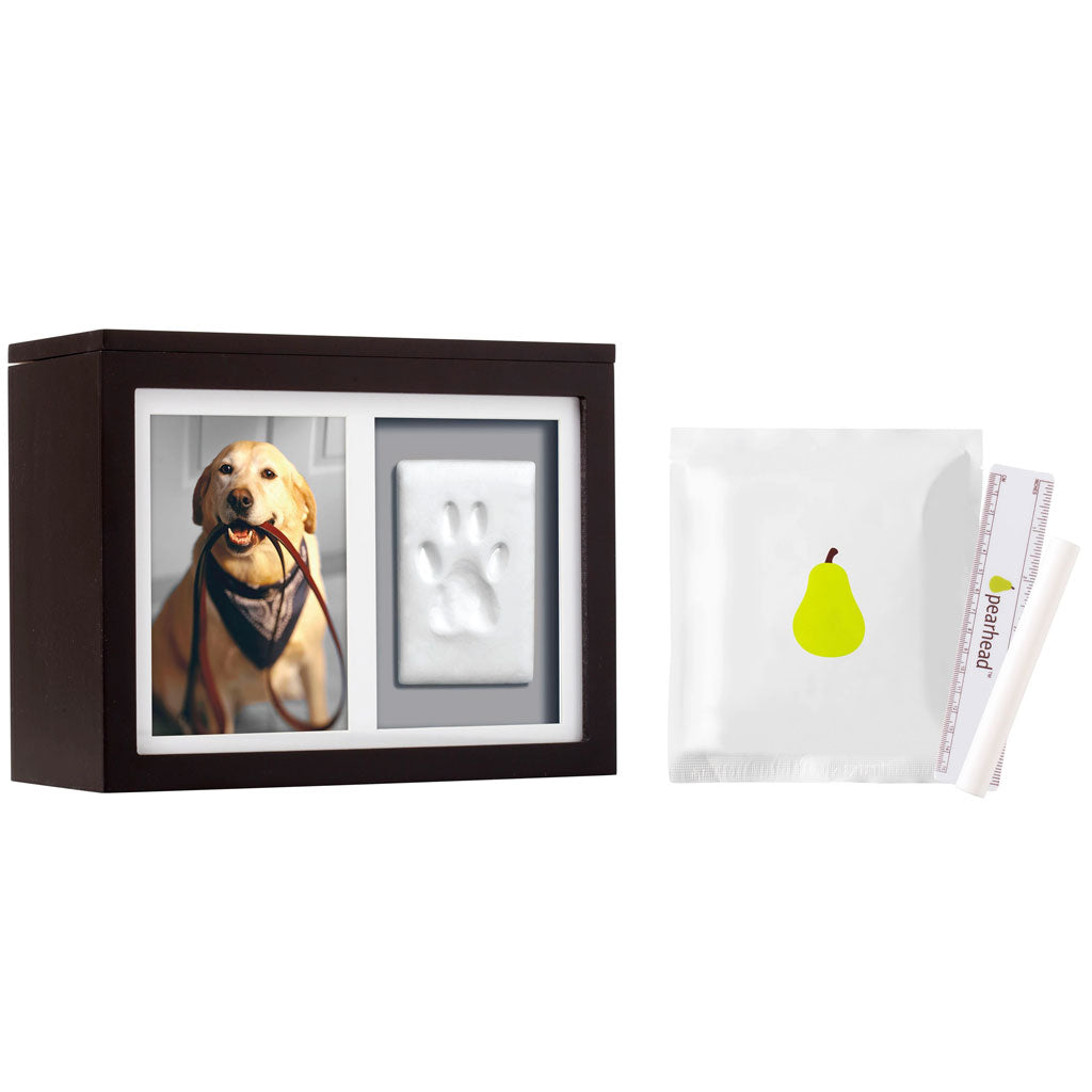 Decorative box with a photo of a dog, a handprint, and a pear illustration on a white background.