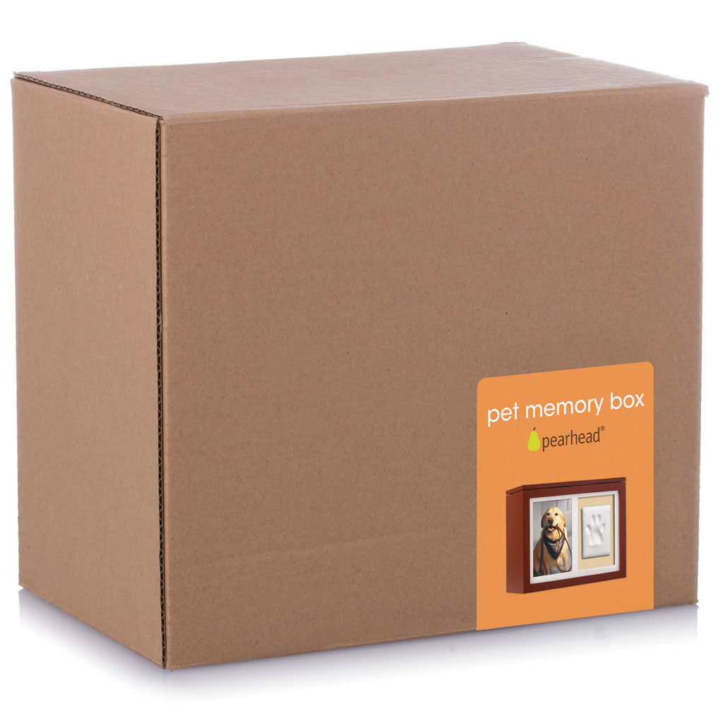 Brown cardboard box with Pearhead pet memory box label on a white background