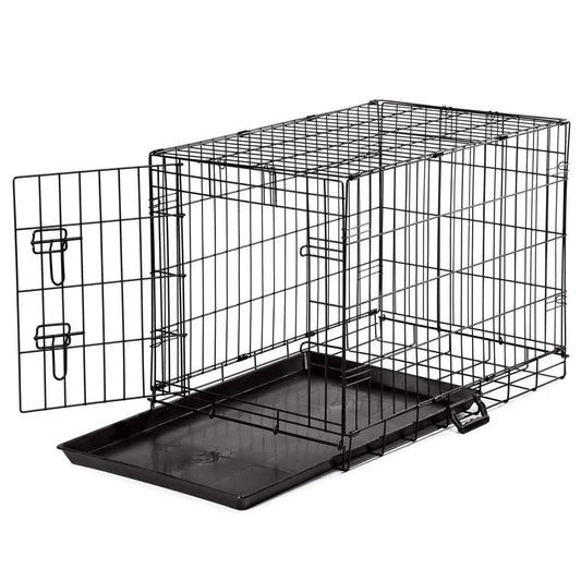 Black metal pet crate with a tray on a white background