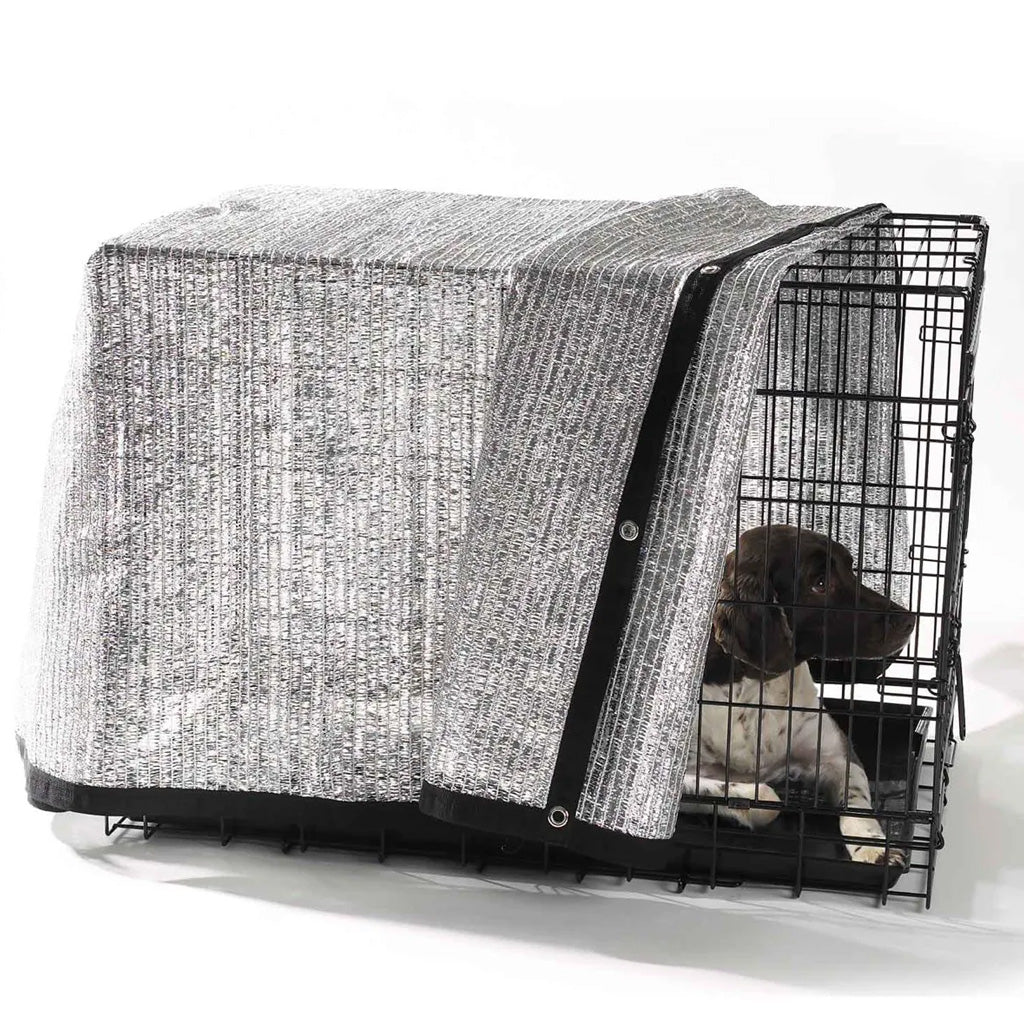 Dog crate with a black and white patterned cover on a white background