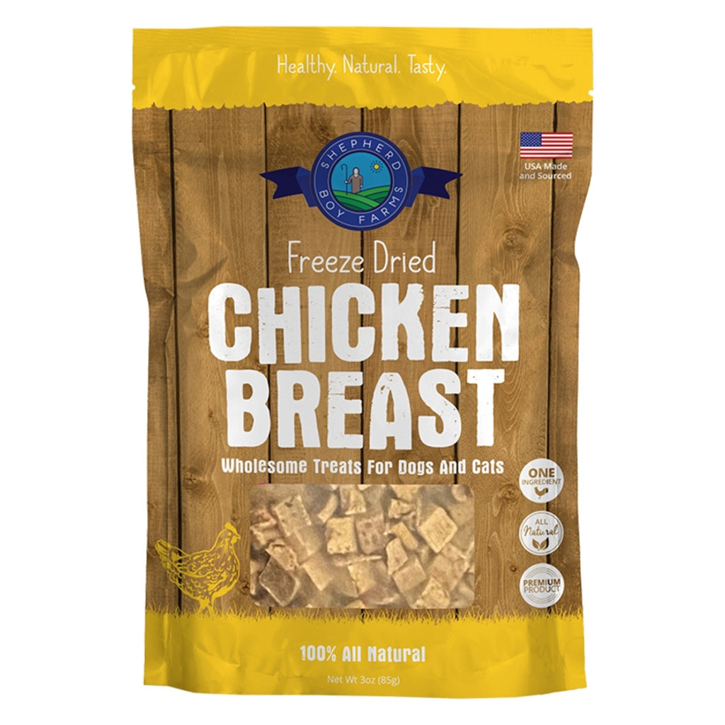 Package of freeze-dried chicken breast treats for pets on a wooden background