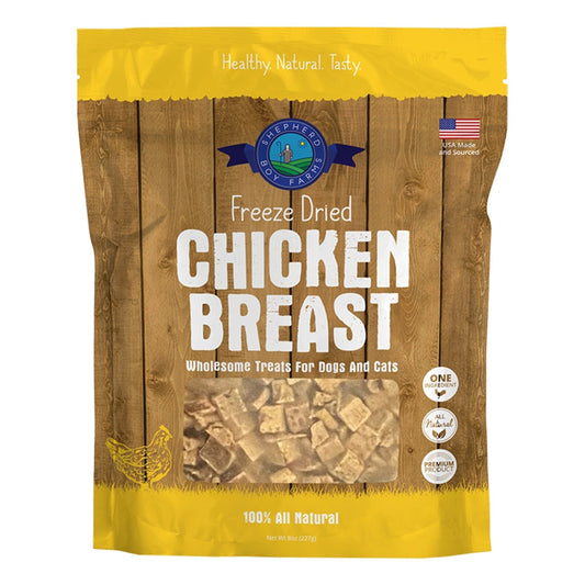 Package of freeze-dried chicken breast treats for pets on a wooden background