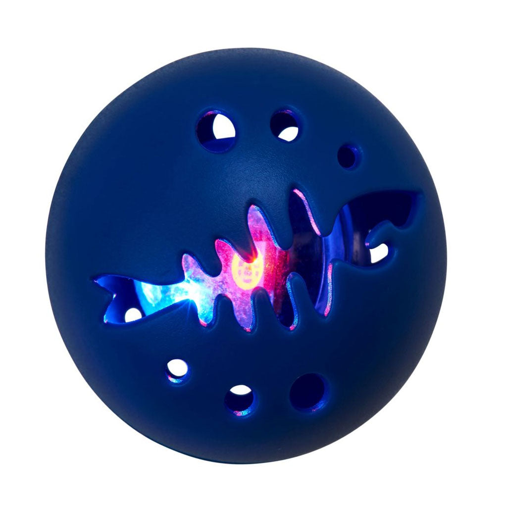 Blue ball with fish cutout and glowing interior on a white background