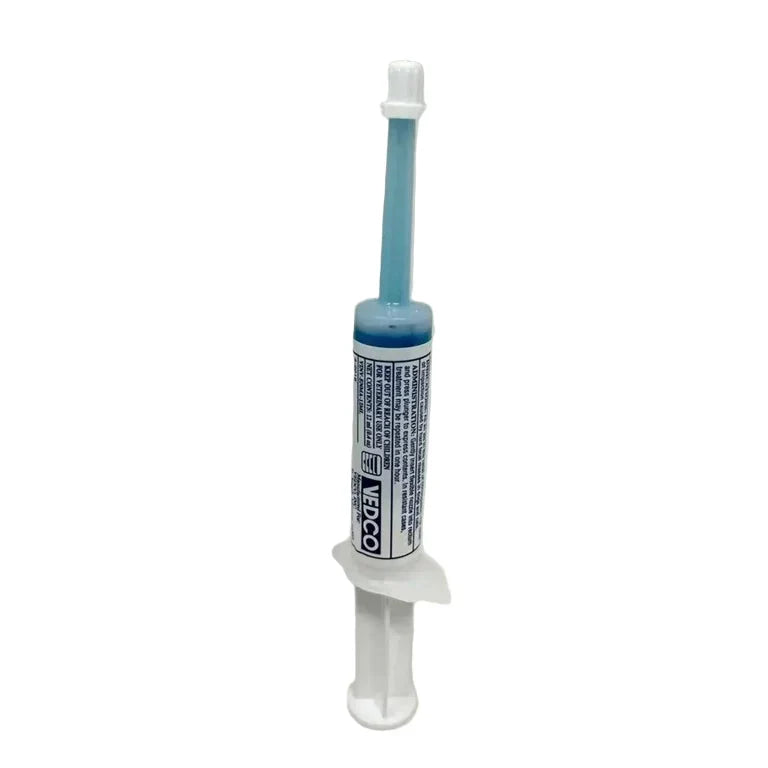 Venco dental syringe with blue liquid on a gray background